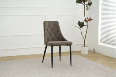 Alt Tag: Shelly Dining Chairs - Upholstered grey stitched upholstered dining chair with black legs, modern accent seating in minimalist room