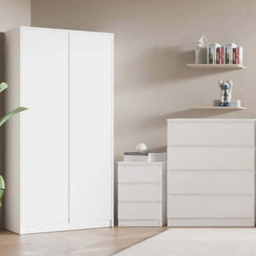 Alt Tag: The Clarkson Trio Bedroom Furniture set with white wardrobe, bedside cabinet and chest of drawers in modern minimalist rental bedroom