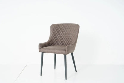 Alt Tag: Suede Oxford Fabric Dining Chairs in grey faux suede with quilted back, padded armchair-style seat and black tapered legs