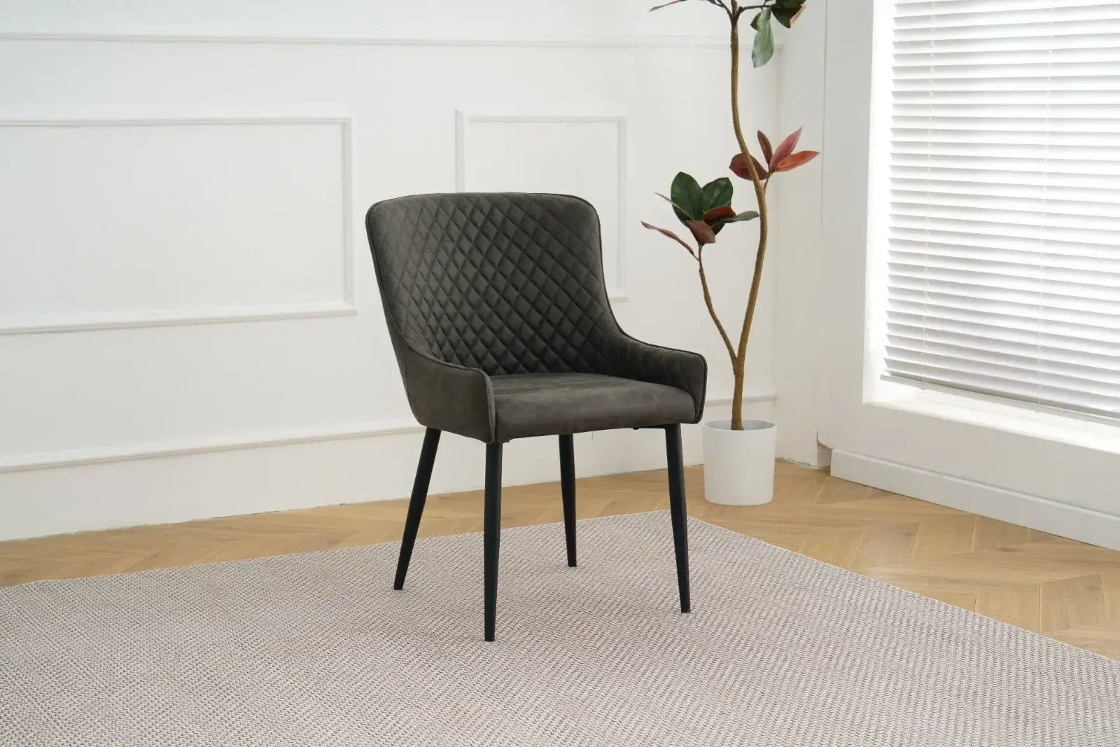 Alt Tag: Suede Oxford Fabric Dining Chairs in grey suede with quilted backrest and black legs, modern dining chair