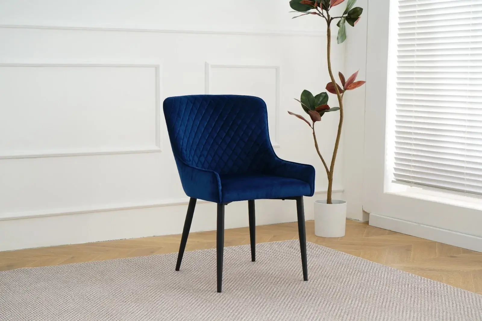 Alt Tag: Suede Oxford Fabric Dining Chairs in navy velvet, quilted dining chair with black legs in modern dining room