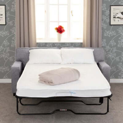 Alt Tag: Redgrave 2-Seater Sofabed in grey fabric opened as a bed with white mattress and pillows in a compact room