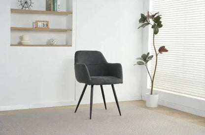 Alt Tag: Ruby Dining Chairs - Upholstered charcoal fabric dining chair with curved backrest and black legs in modern room setting