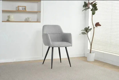 Alt Tag: Ruby Dining Chairs - Upholstered light grey fabric dining chair with black legs in modern minimalist interior
