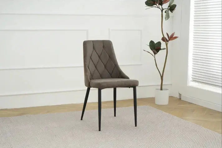 Alt Tag: Shelly Dining Chairs - Upholstered grey stitched upholstered dining chair with black legs, modern accent seating in minimalist room