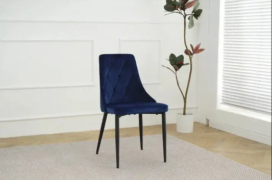 Alt Tag: Shelly Dining Chairs - Upholstered blue velvet dining chair with stitched detailing and black legs in modern dining room setting