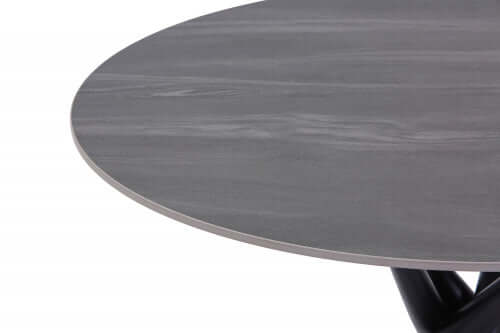 Alt Tag: Tuscan Dining Table close-up of round grey granite-effect tabletop with black metal legs